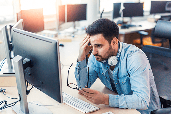 Frustrated person on computer