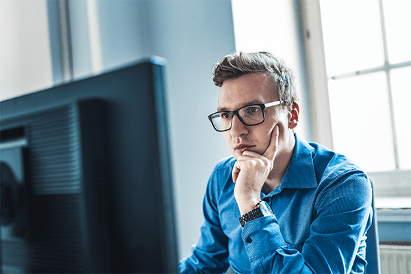 Man checking his email at work