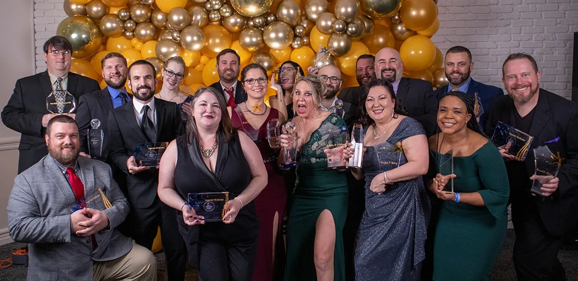 Wizards holding trophies