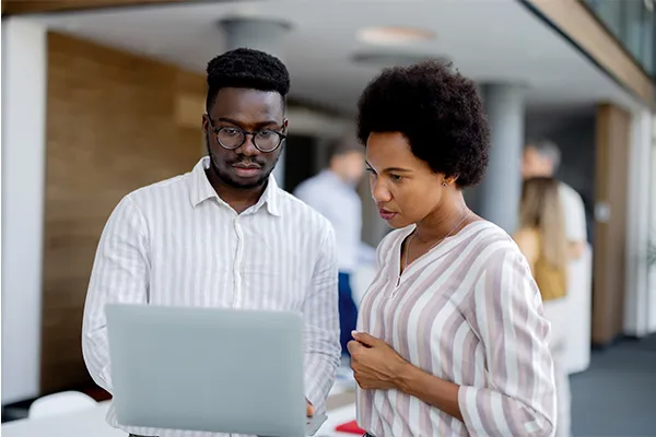 IT professionals looking at a computer