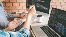 Two men developing software