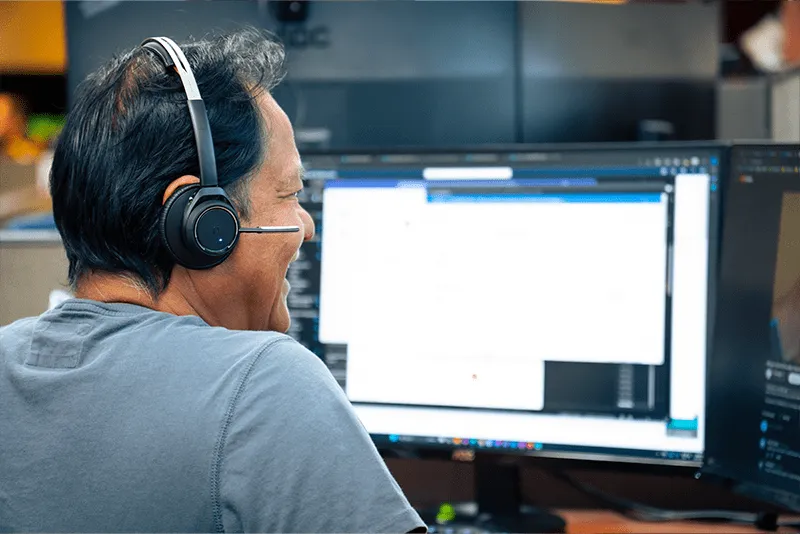 MITS tech working on a computer