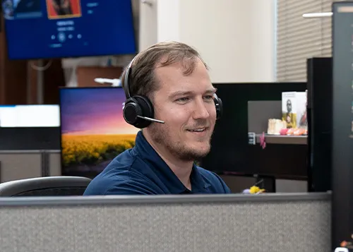 MITS tech working on a computer