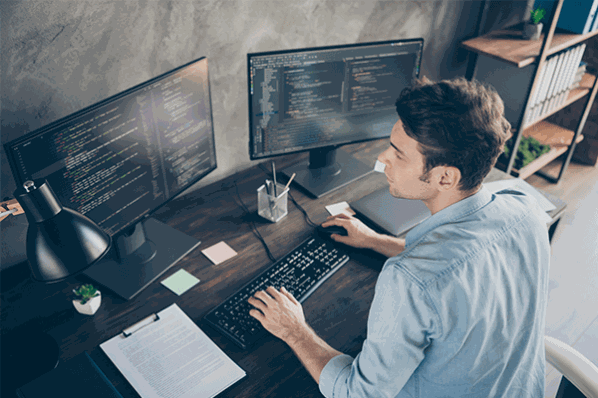 Man coding at work
